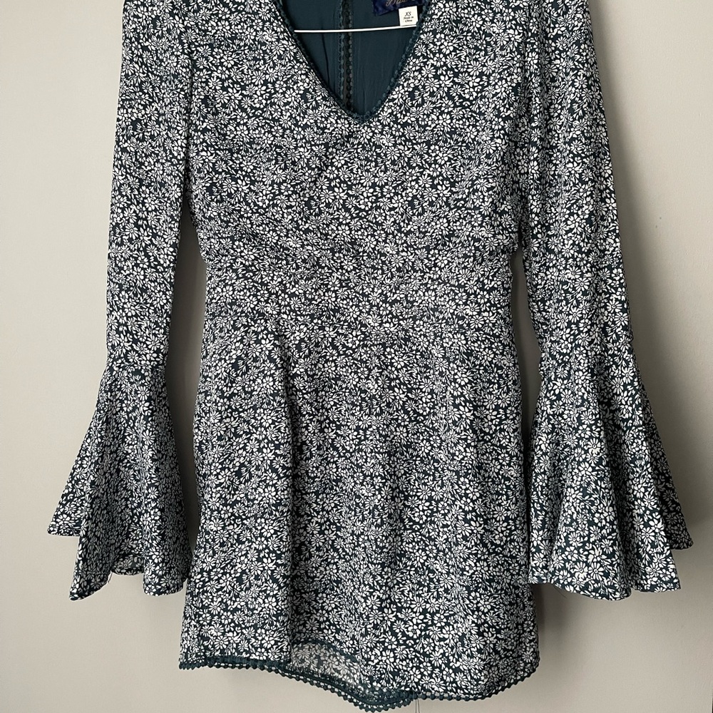 Bell sleeve floral print romper with detailed collar and trip on shorts